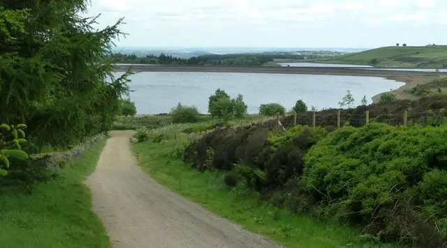 Redmires Reservoir with open heather moorland and wide skies on the edge of the Peak District