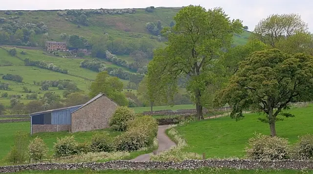 Rolling green farmland and hills around the village of Longnor in the Staffordshire Peak District