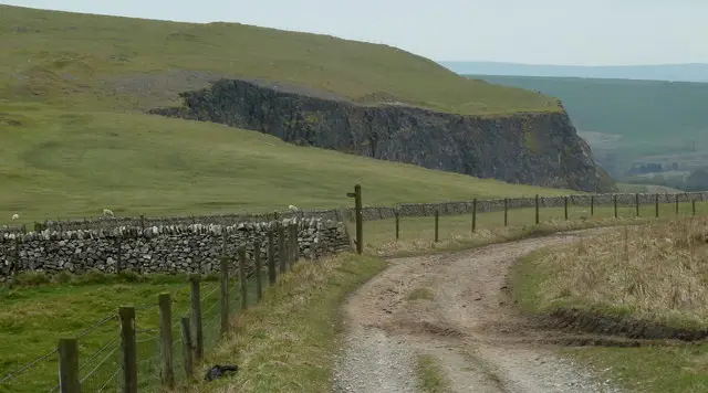 Open limestone grassland and the rounded slopes of Eldon Hill in the White Peak, Derbyshire